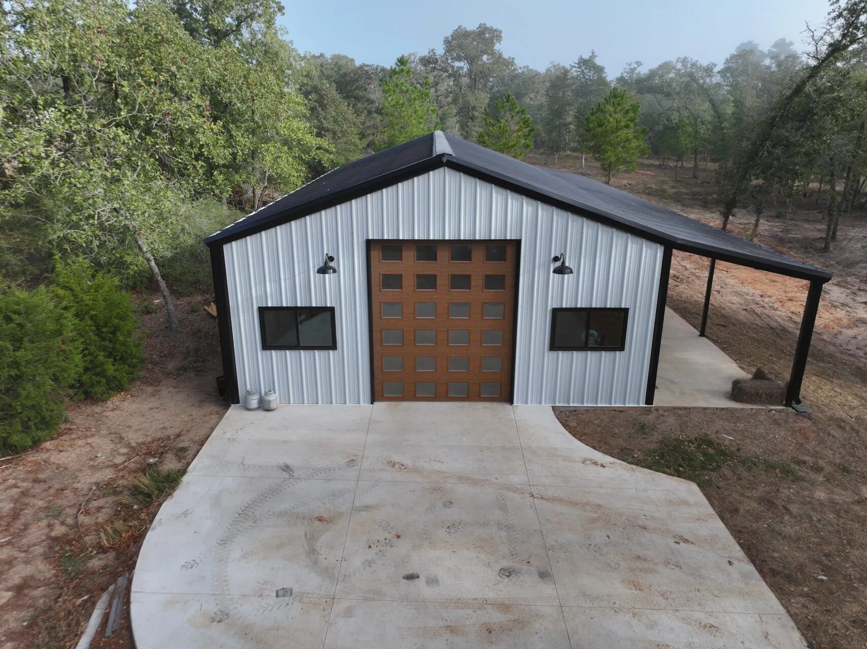 30x60 Fully Custom Red Iron Garage/Storage Building in Bastrop, TX. 30x60 Fully Custom Red Iron Garage/Storage Building in Bastrop, TX.