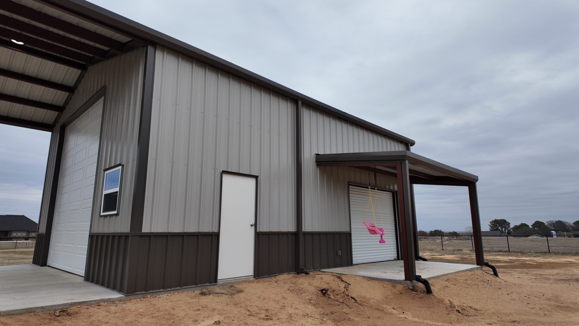 26x45 Red Iron Steel Building with Porch in Boyd, TX.