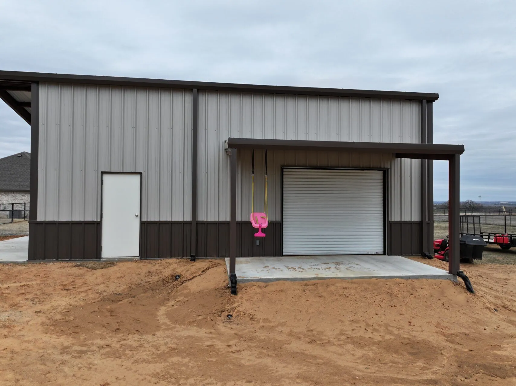 26x45 Red Iron Steel Building with Porch in Boyd, TX.