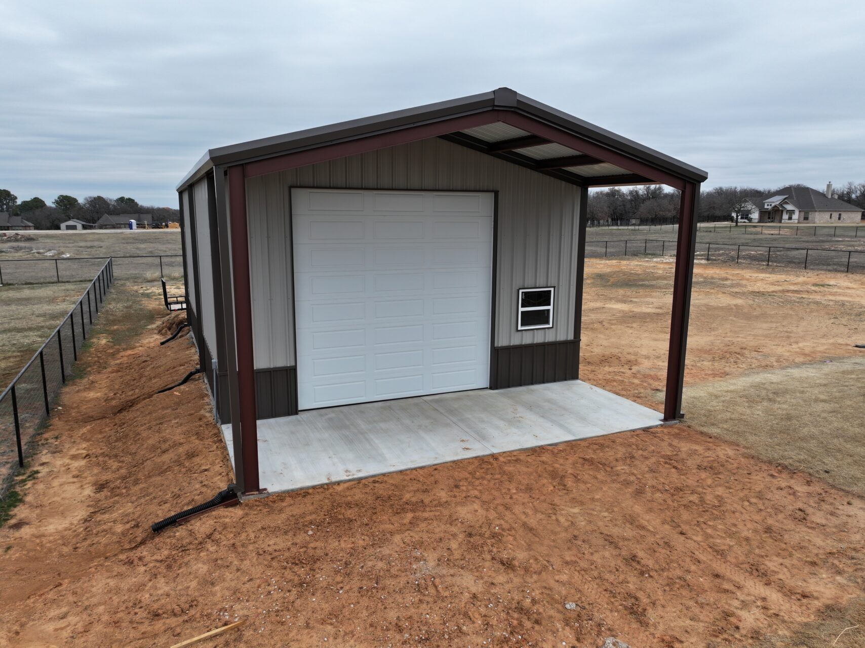 26x45 Red Iron Steel Building with Porch in Boyd, TX.