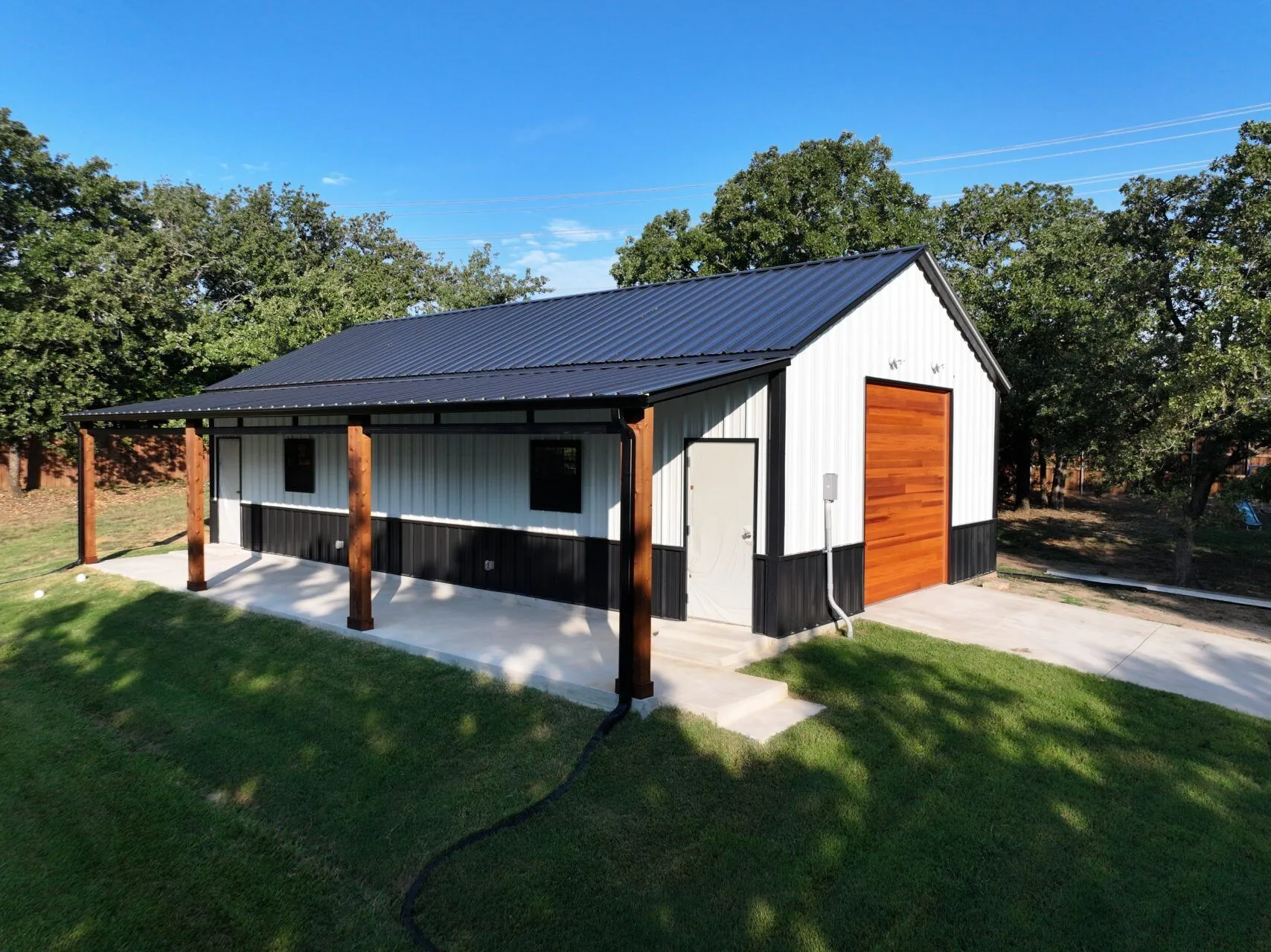 24x45 Custom Metal Garage with Cedar Accents in Flower Mound, TX. 24x45 Custom Metal Garage with Cedar Accents in Flower Mound, TX.