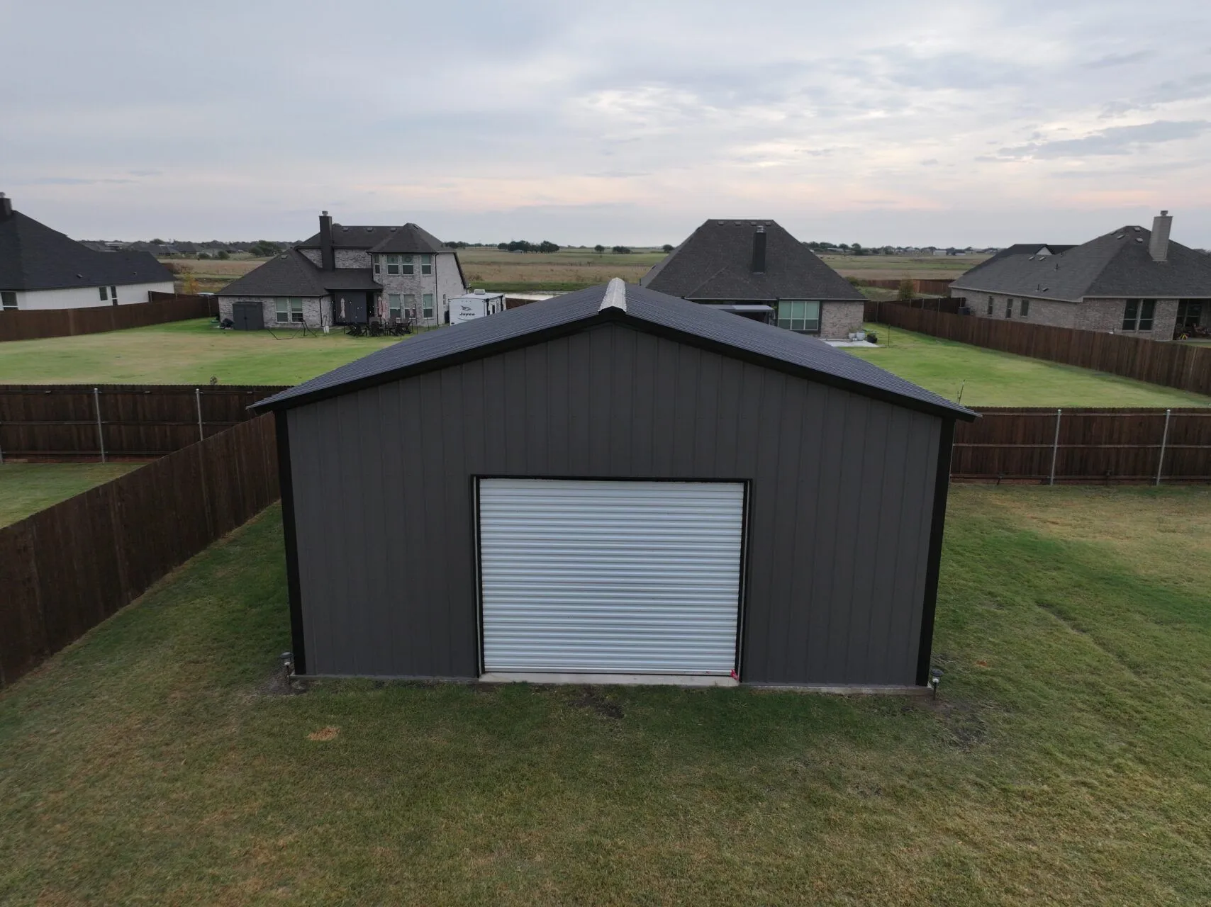 24x25 Black and Grey Tubular Metal Building in Godley, TX. 24x25 Black and Grey Tubular Metal Building in Godley, TX.