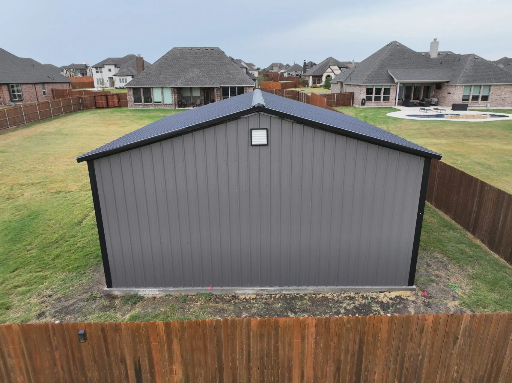 24x25 Black and Grey Tubular Metal Building in Godley, TX. 24x25 Black and Grey Tubular Metal Building in Godley, TX.