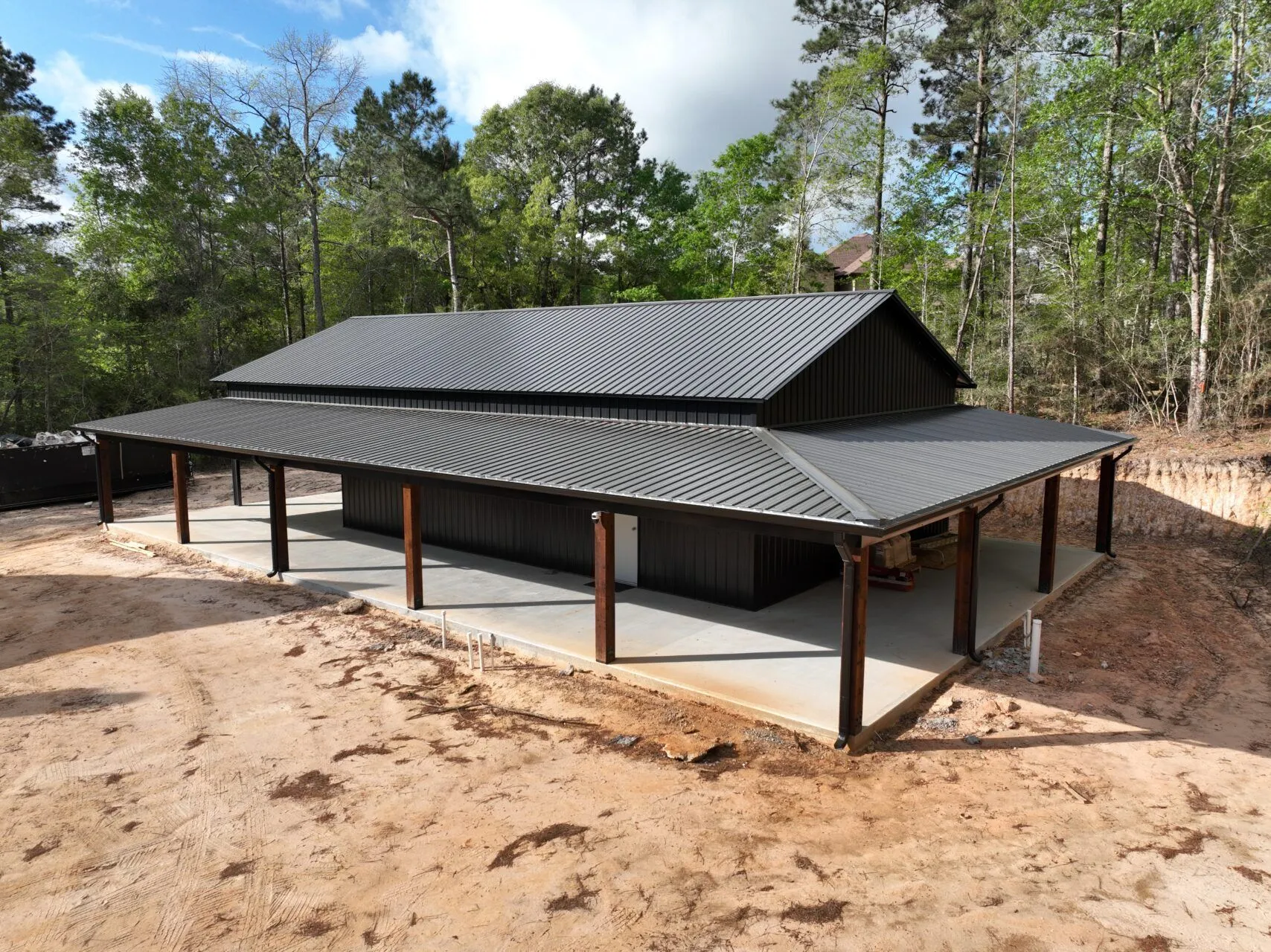 30x60 Custom Blacked-Out Shop with Wrap-around Porch in Montgomery, TX. 30x60 Custom Blacked-Out Shop with Wrap-around Porch in Montgomery, TX.