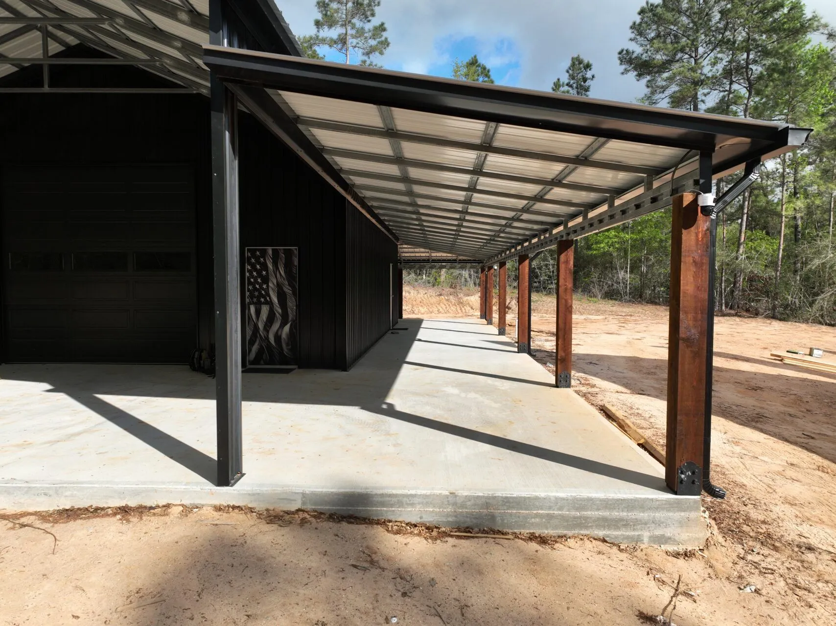30x60 Custom Blacked-Out Shop with Wrap-around Porch in Montgomery, TX. 30x60 Custom Blacked-Out Shop with Wrap-around Porch in Montgomery, TX.