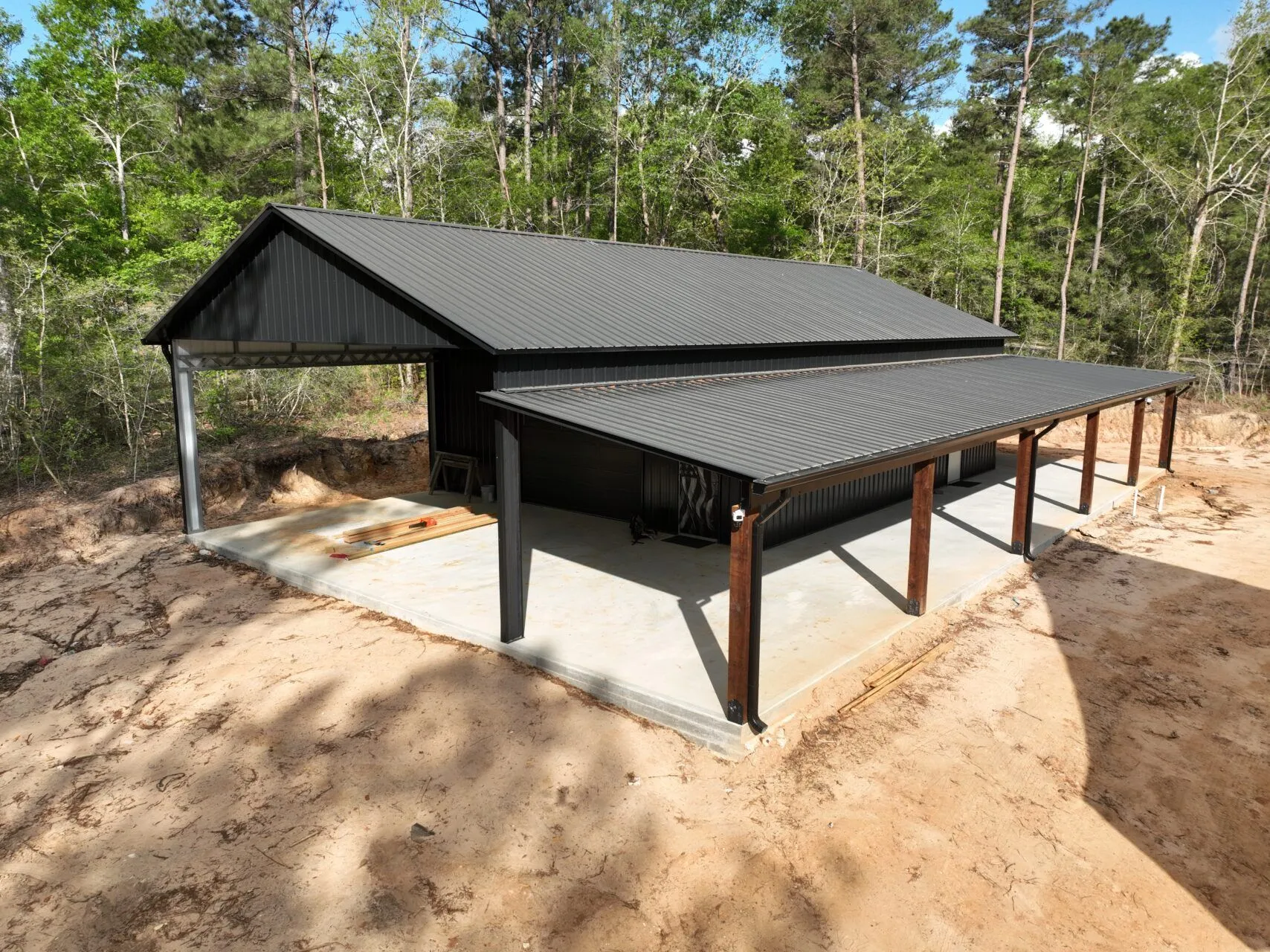 30x60 Custom Blacked-Out Shop with Wrap-around Porch in Montgomery, TX. 30x60 Custom Blacked-Out Shop with Wrap-around Porch in Montgomery, TX.