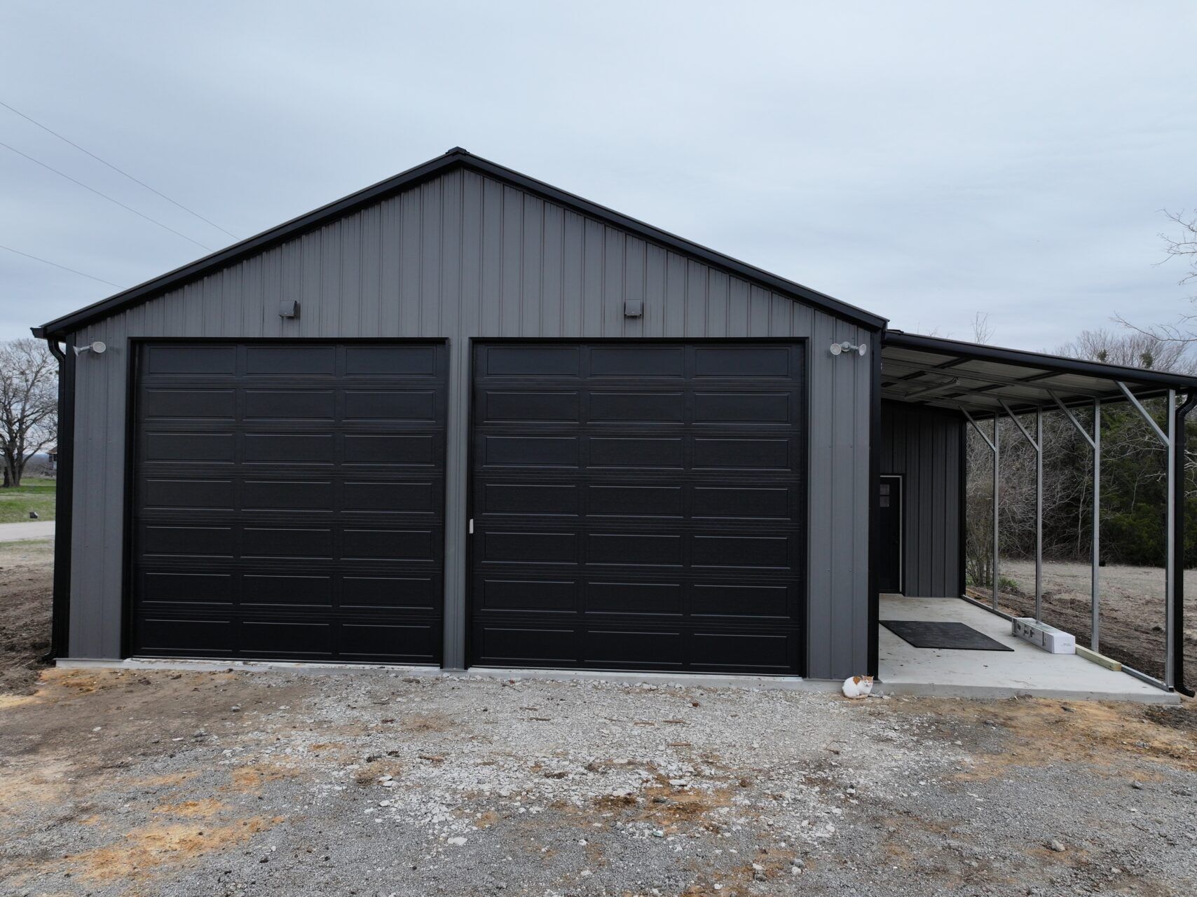 30x40 Metal Building with Custom Lean-to Porch in Ennis, TX.