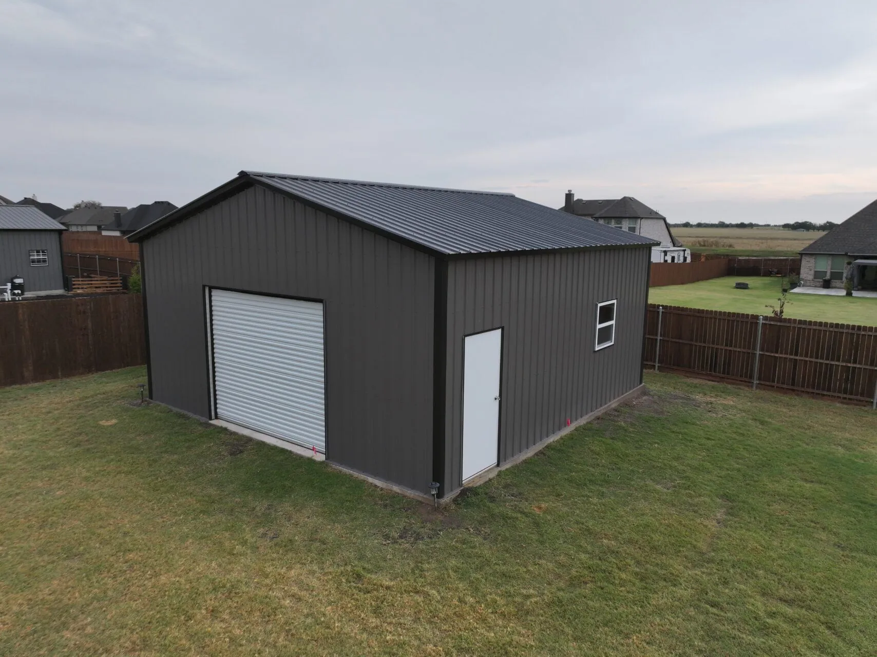 24x25 Black and Grey Tubular Metal Building in Godley, TX. 24x25 Black and Grey Tubular Metal Building in Godley, TX.