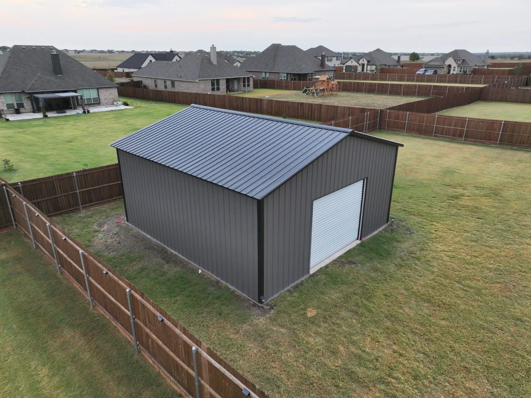 24x25 Black and Grey Tubular Metal Building in Godley, TX. 24x25 Black and Grey Tubular Metal Building in Godley, TX.
