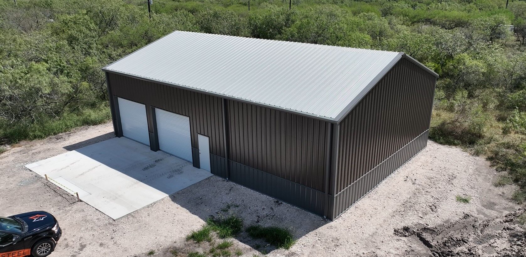 40x60 Red Iron Metal Building in Skidmore, Texas 7838 40x60 Metal Garage with Concrete