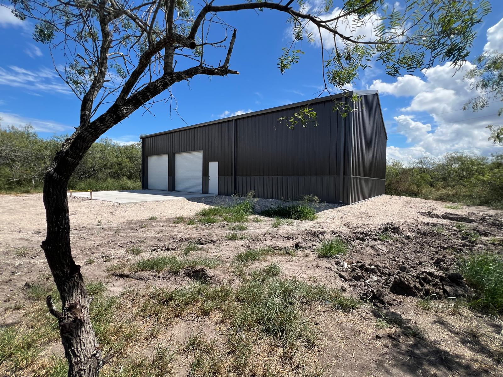 40x60 Red Iron Metal Building in Skidmore, Texas 7838 40x60 Metal Garage with Concrete