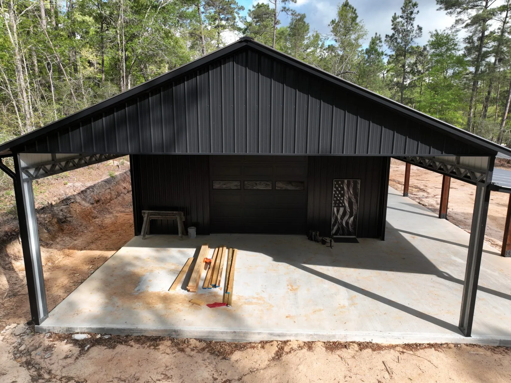 30x60 Custom Blacked-Out Shop with Wrap-around Porch in Montgomery, TX. 30x60 Custom Blacked-Out Shop with Wrap-around Porch in Montgomery, TX.