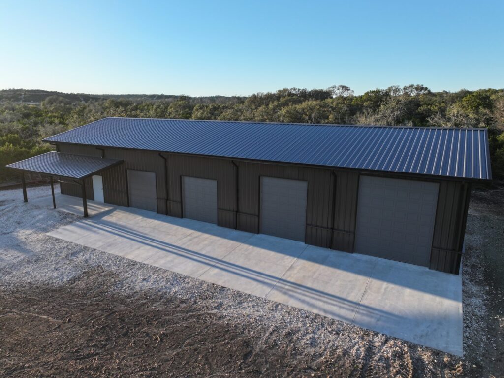 40x100 Custom Weld Up Red Iron Steel Garage in Kerrville, Texas.