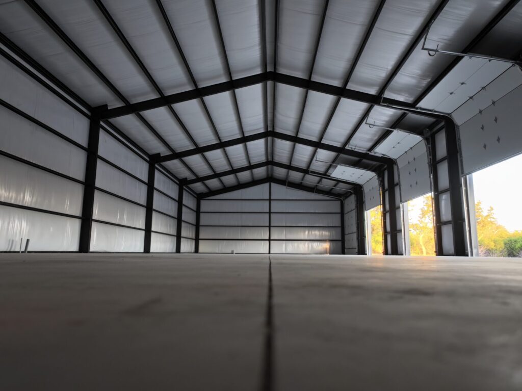 40x100 Custom Weld Up Red Iron Steel Garage in Kerrville, Texas.