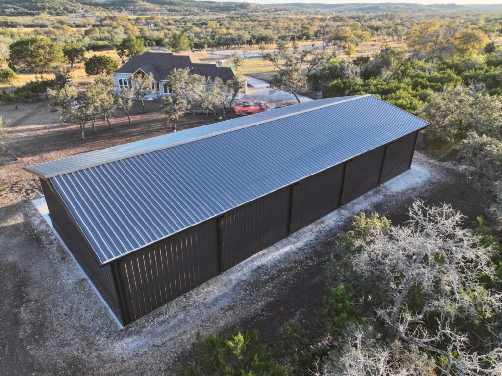 40x100 Custom Weld Up Red Iron Steel Garage in Kerrville, Texas.