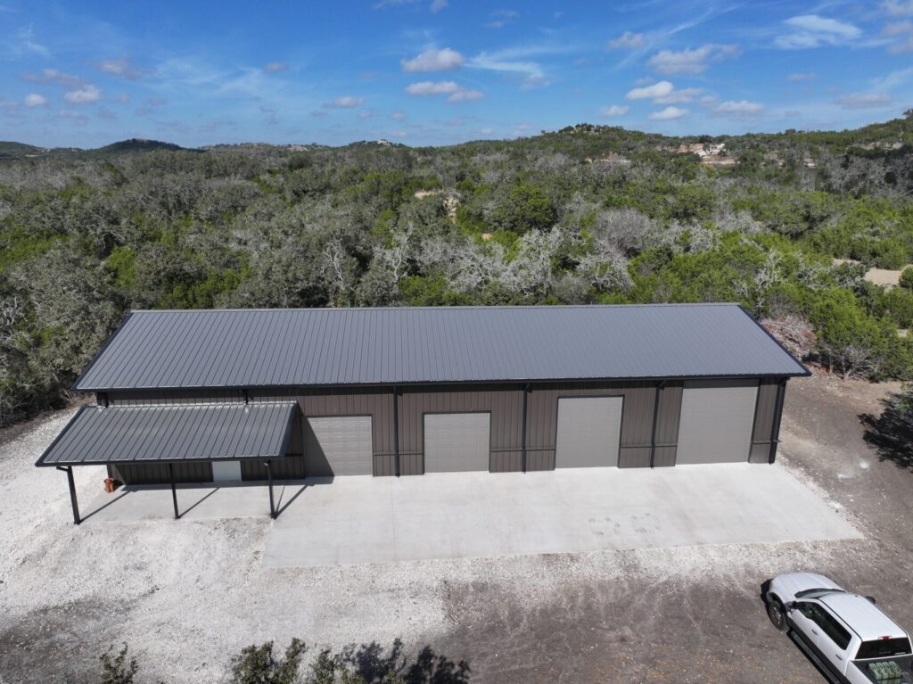 40x100 Custom Weld Up Red Iron Steel Garage in Kerrville, Texas.