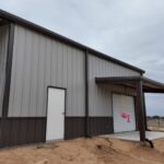 26x45 Red Iron Steel Building with Porch in Boyd, TX.