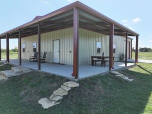 40x50 Red Iron Steel Building with Wraparound Porch in Kaufman, TX.