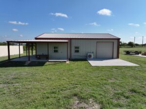 40x50 Red Iron Steel Building with Wraparound Porch in Kaufman, TX.